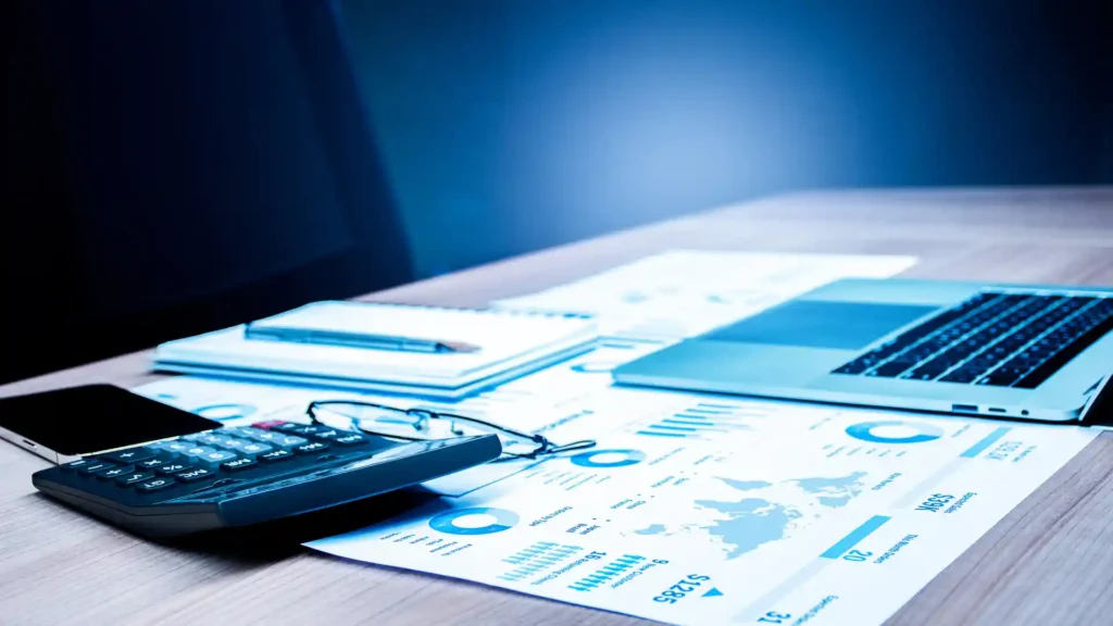 vecteezy_calculator-laptop-and-paperwork-on-table-in-meeting-room_16561537 (1)