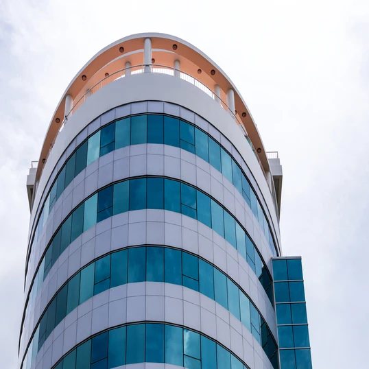 vecteezy_circular-building-with-lots-of-blue-glass_7674441 (1)